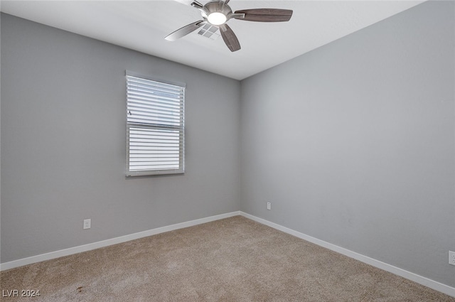 spare room with carpet flooring and ceiling fan