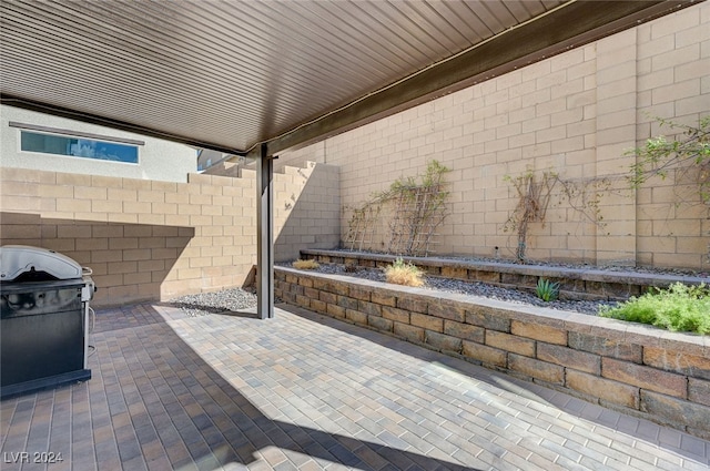 view of patio featuring a grill