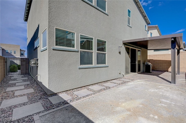 rear view of property featuring a patio