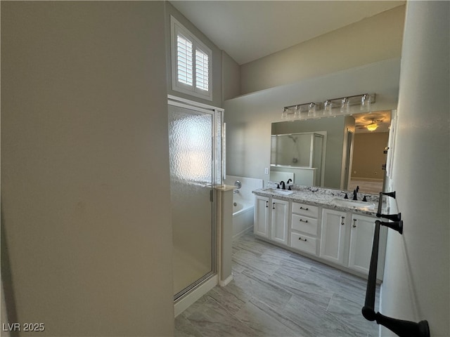 bathroom with vanity and separate shower and tub