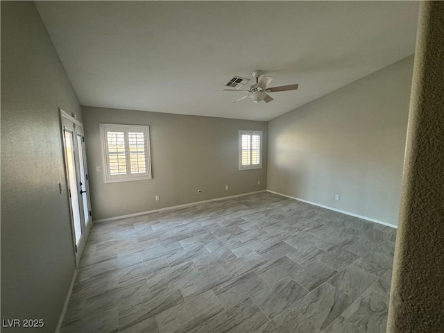 unfurnished room with ceiling fan