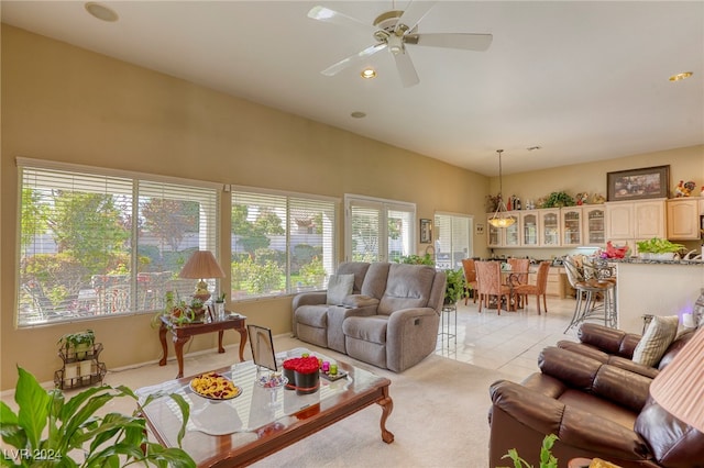 tiled living room with ceiling fan