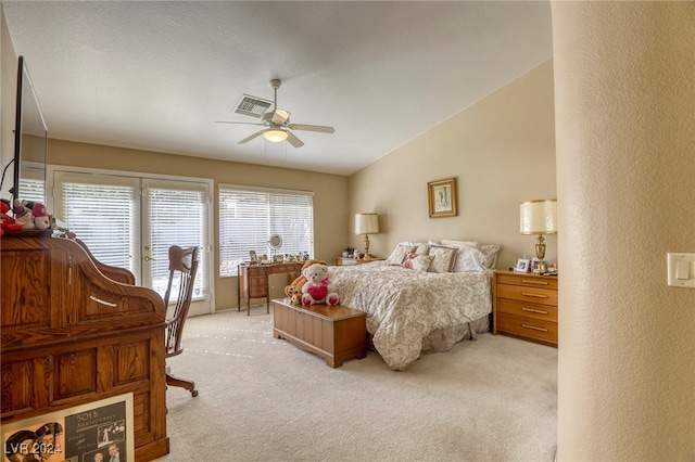 bedroom with vaulted ceiling, light colored carpet, access to outside, and ceiling fan