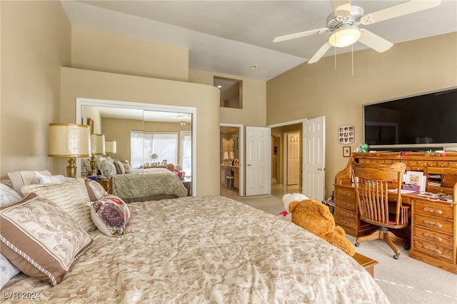 bedroom with a closet, ceiling fan, high vaulted ceiling, and light colored carpet