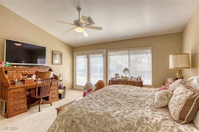 bedroom with light colored carpet, vaulted ceiling, and ceiling fan