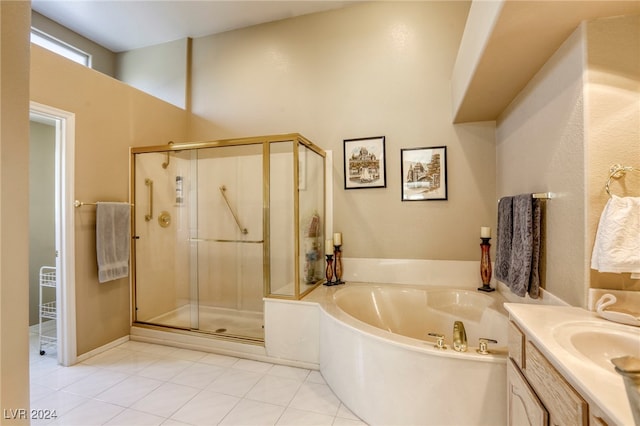 bathroom featuring vanity, independent shower and bath, and tile patterned floors