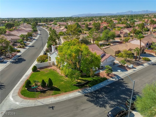 birds eye view of property with a mountain view