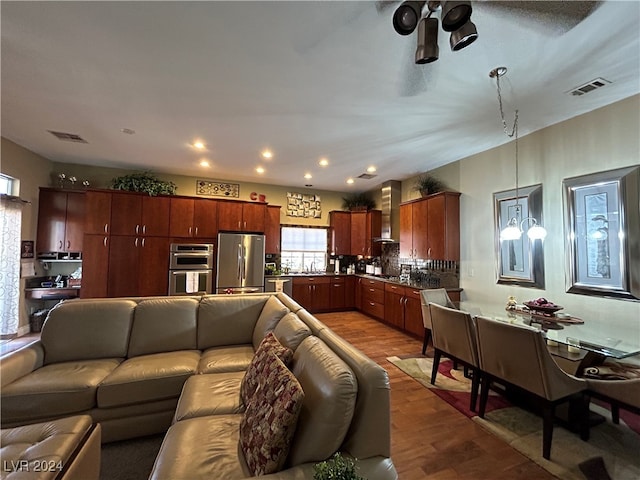 living room featuring sink and hardwood / wood-style flooring