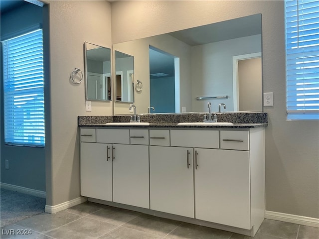 bathroom featuring vanity, tile patterned floors, and plenty of natural light