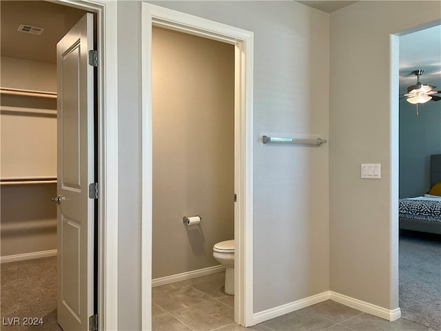 bathroom featuring tile patterned floors, toilet, and ceiling fan