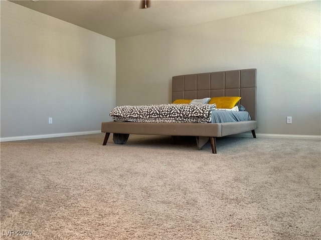 bedroom featuring light carpet