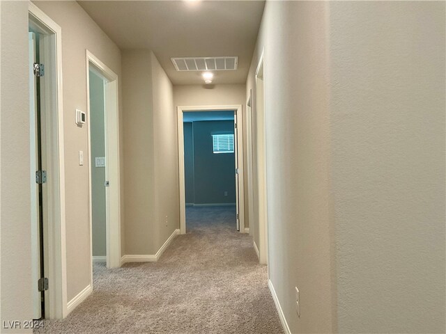 corridor with light carpet