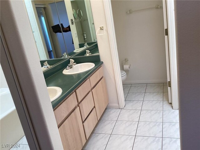 491 Marina Cv, Boulder City, NV 89005 - full bath with toilet, double vanity, tile patterned floors, and baseboards