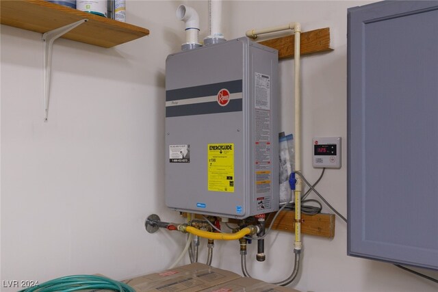 utility room with water heater