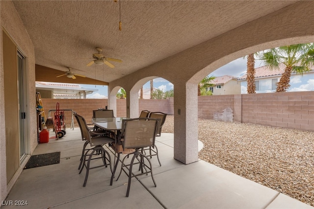 view of patio featuring ceiling fan