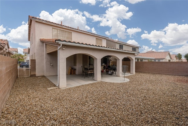 back of house featuring a patio area