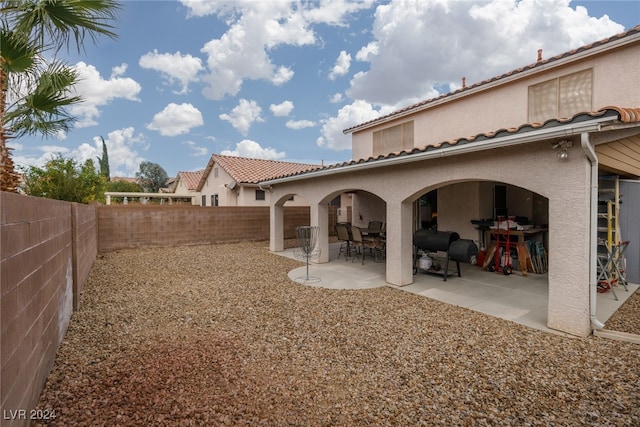 back of property featuring a patio area