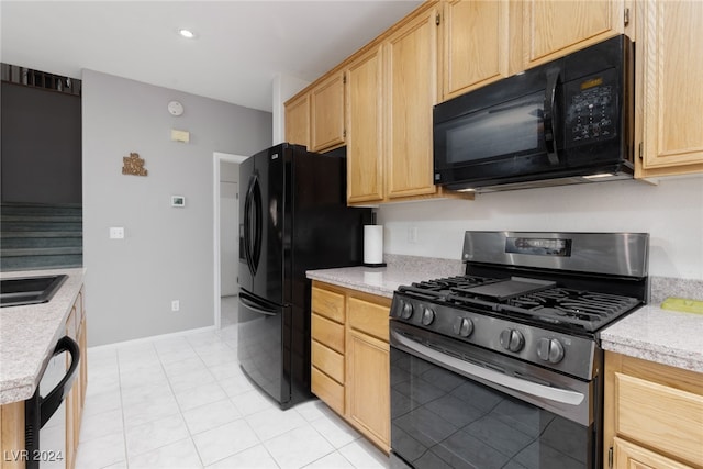 kitchen with light brown cabinets, black appliances, and light tile patterned floors