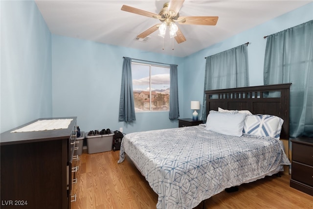 bedroom featuring ceiling fan and light hardwood / wood-style flooring