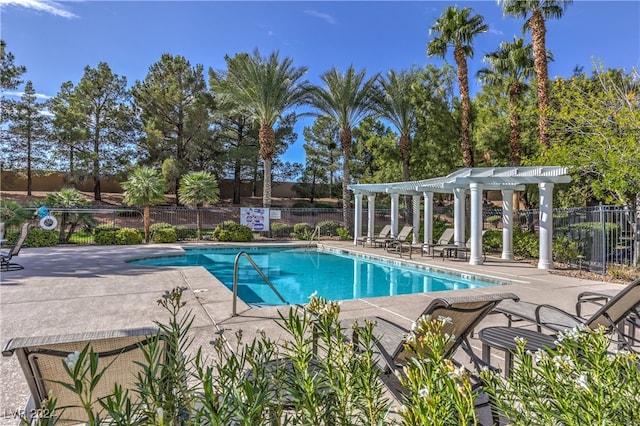 view of swimming pool featuring a patio and a pergola