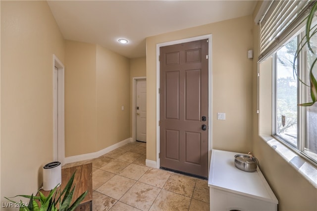 foyer entrance featuring light tile patterned floors