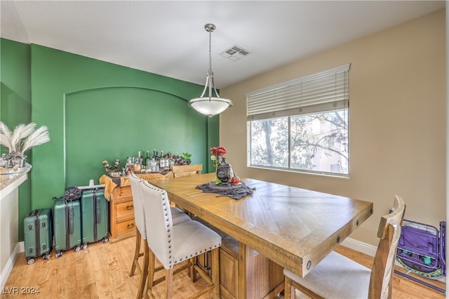 dining space with light wood-type flooring