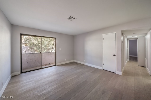 spare room with light wood-type flooring