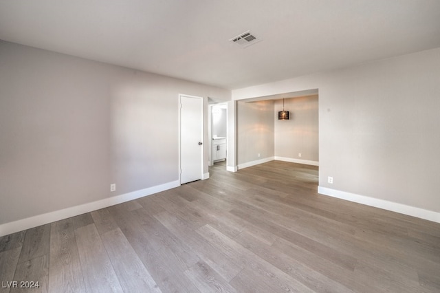 spare room with hardwood / wood-style flooring