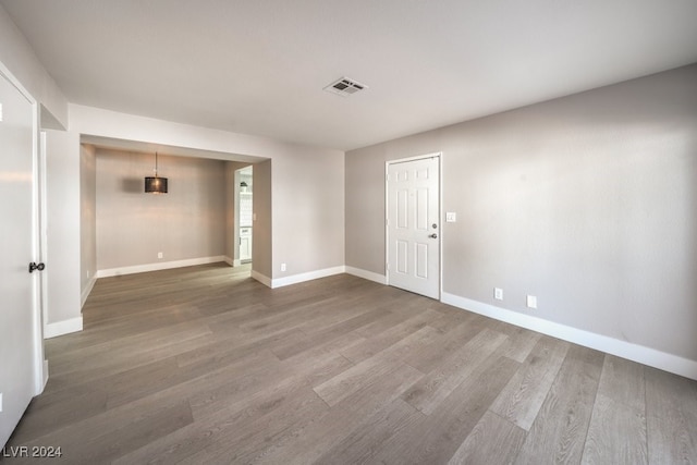 spare room with hardwood / wood-style flooring