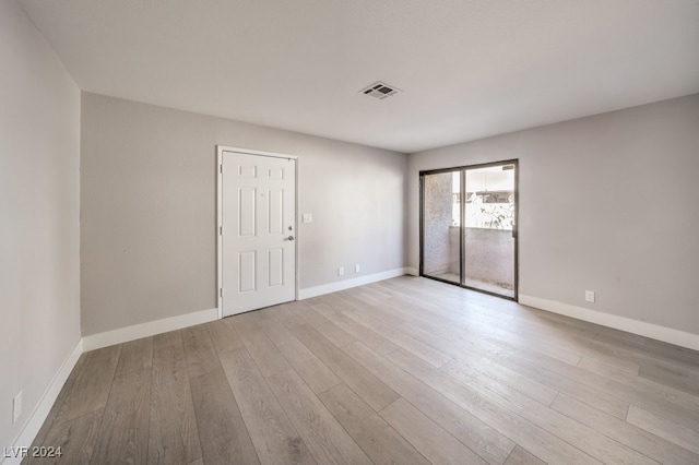 empty room with light wood-type flooring