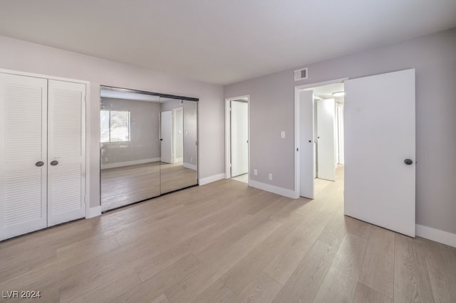 unfurnished bedroom featuring light hardwood / wood-style floors