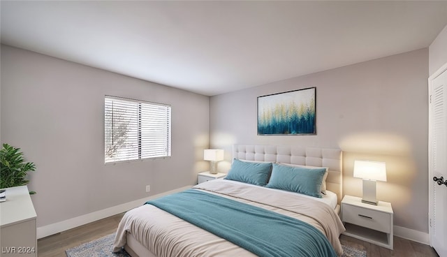 bedroom with hardwood / wood-style floors