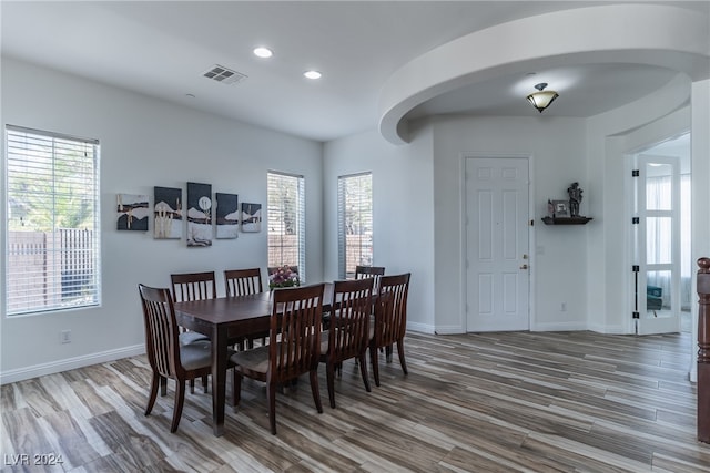 dining room with hardwood / wood-style floors and a wealth of natural light