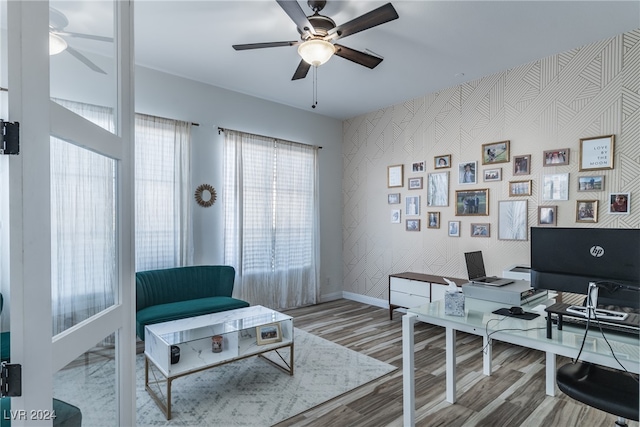 home office with ceiling fan and hardwood / wood-style flooring