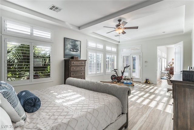 bedroom with light hardwood / wood-style floors and ceiling fan