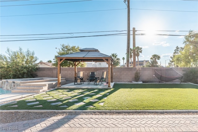 view of yard with a patio, a gazebo, and a trampoline