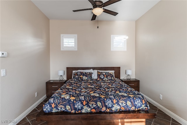 tiled bedroom featuring ceiling fan