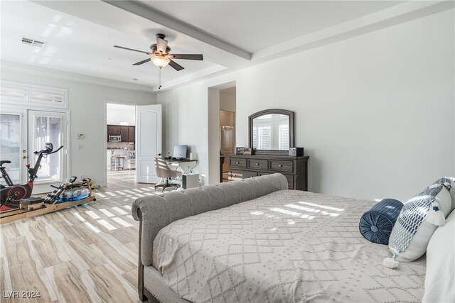 bedroom featuring beamed ceiling and ceiling fan