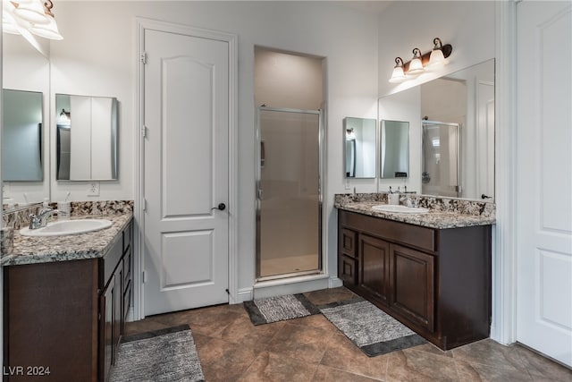 bathroom featuring vanity and walk in shower