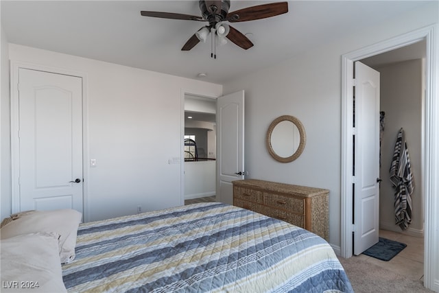 bedroom with light colored carpet and ceiling fan