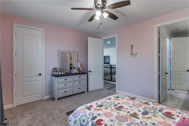 carpeted bedroom featuring ceiling fan