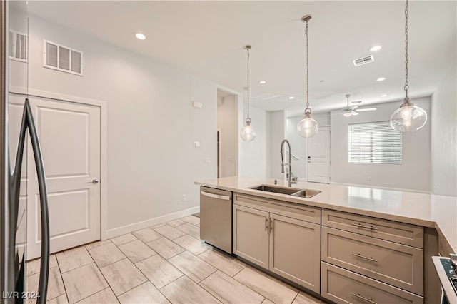 kitchen featuring ceiling fan, sink, stainless steel dishwasher, and decorative light fixtures