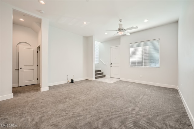 carpeted empty room with ceiling fan