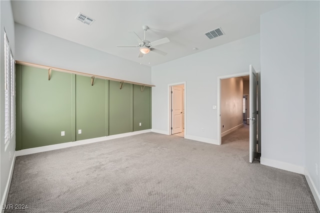 unfurnished bedroom with carpet flooring and ceiling fan