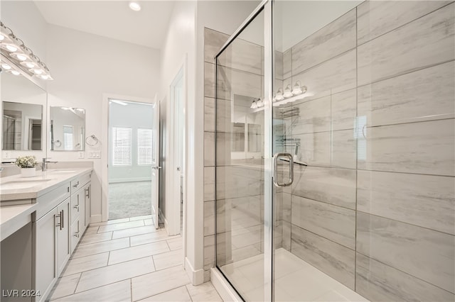 bathroom featuring vanity, tile patterned floors, and an enclosed shower