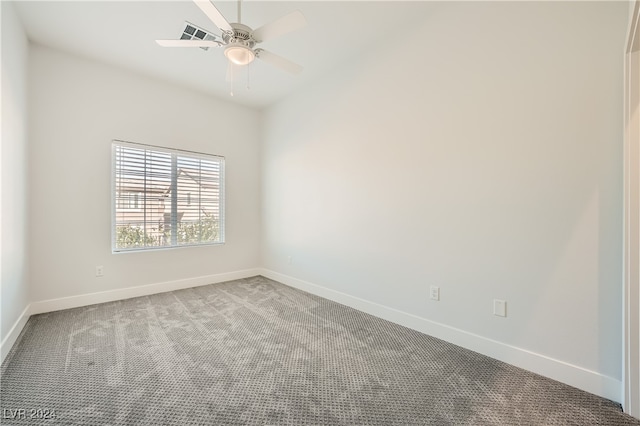 empty room featuring carpet flooring and ceiling fan