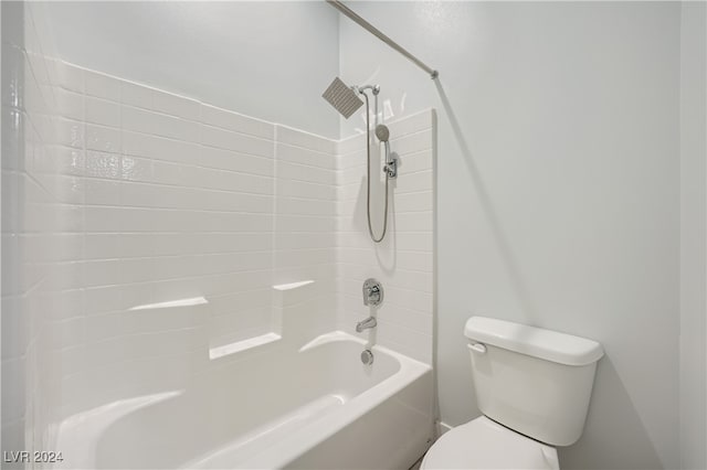 bathroom with toilet and shower / washtub combination