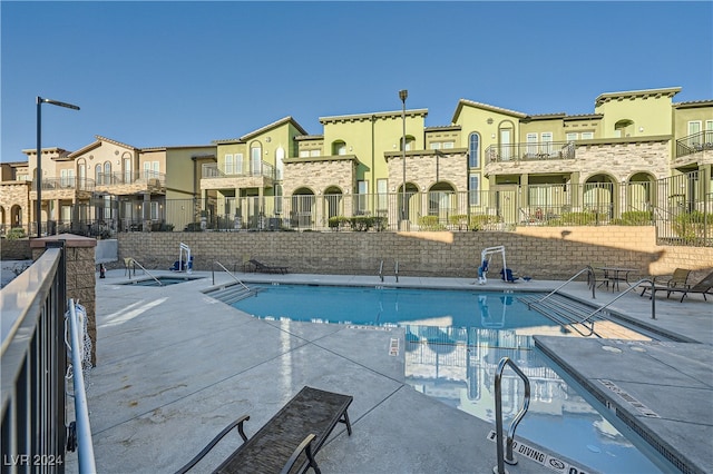 view of pool featuring a patio