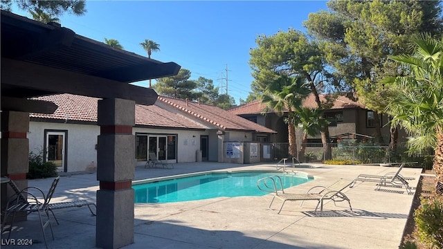 view of swimming pool featuring a patio area