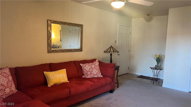 carpeted living room featuring ceiling fan